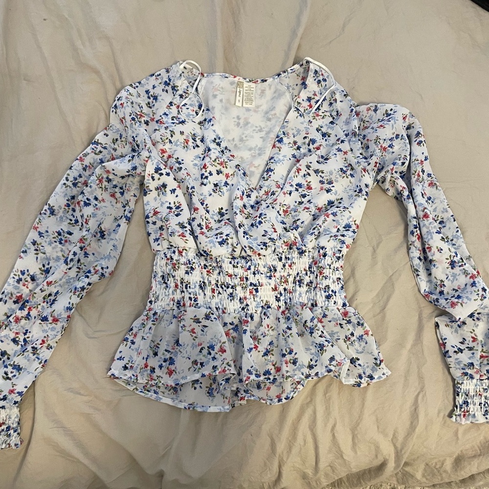 Floral surplice wrap blouse with cinched waist